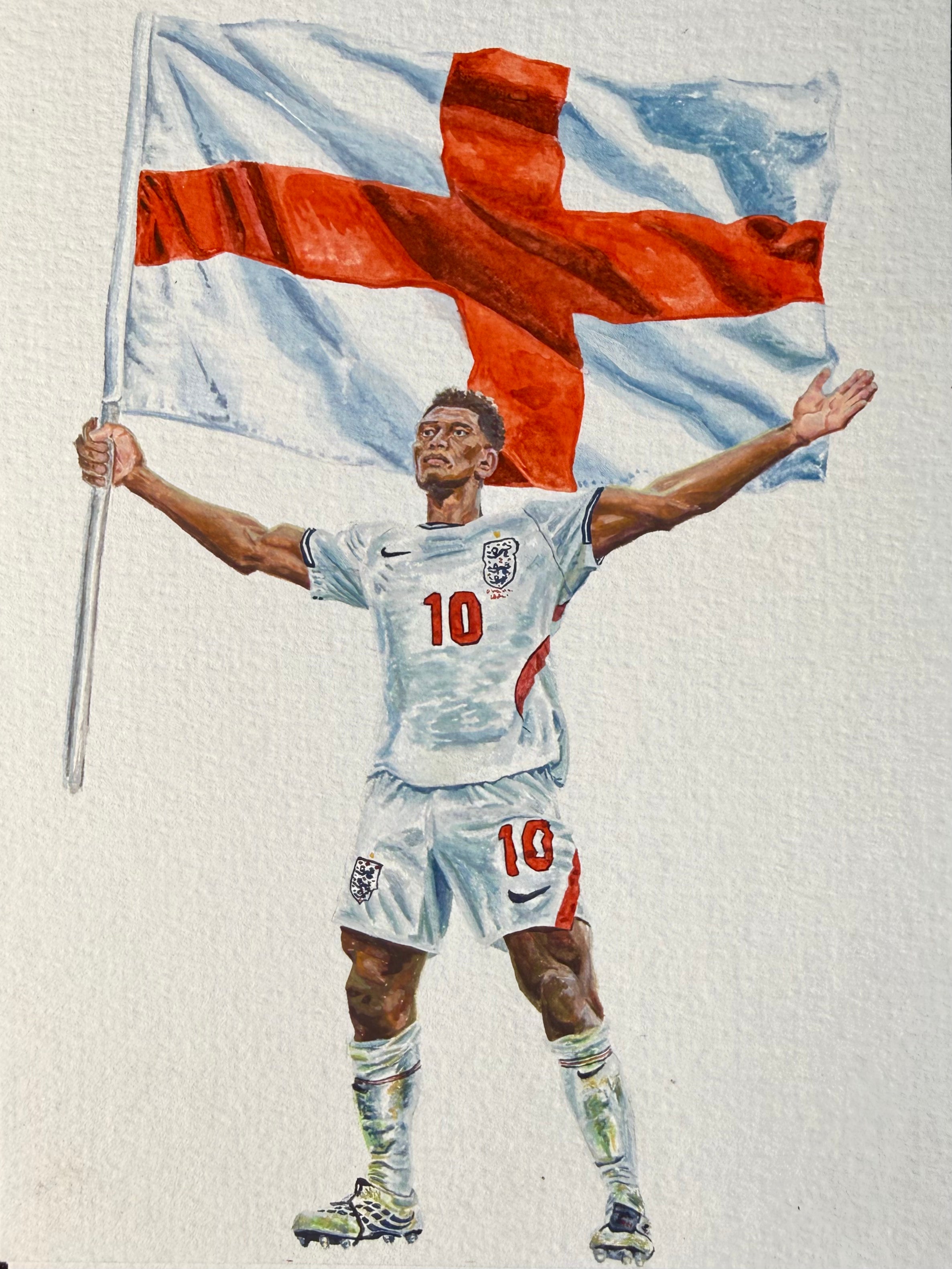 A painted illustration of a Jude Bellingham in an England jersey and shorts, holding a large red cross flag above his head against a plain light background.